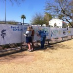 Vickie, Ed, and K.D. painting the fence at the Blues Blast Vickie, Ed, and K.D. painting the fence at the Blues Blast