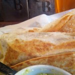 Pastor Burrito Pastor Burrito - sliced pork shoulder marinated in achiote citrus with sliced pineapple, cilantro, white onions & pinto beans.